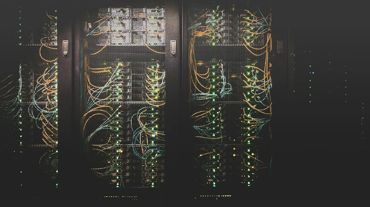 Server racks with network cables and status lights in a data centre