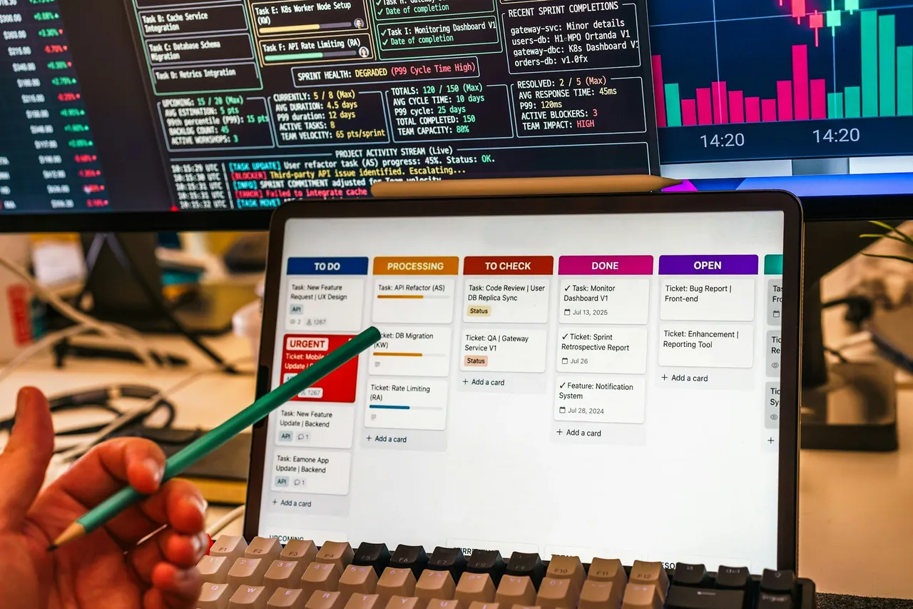 A kanban board on a tablet, with a pen pointing at a task