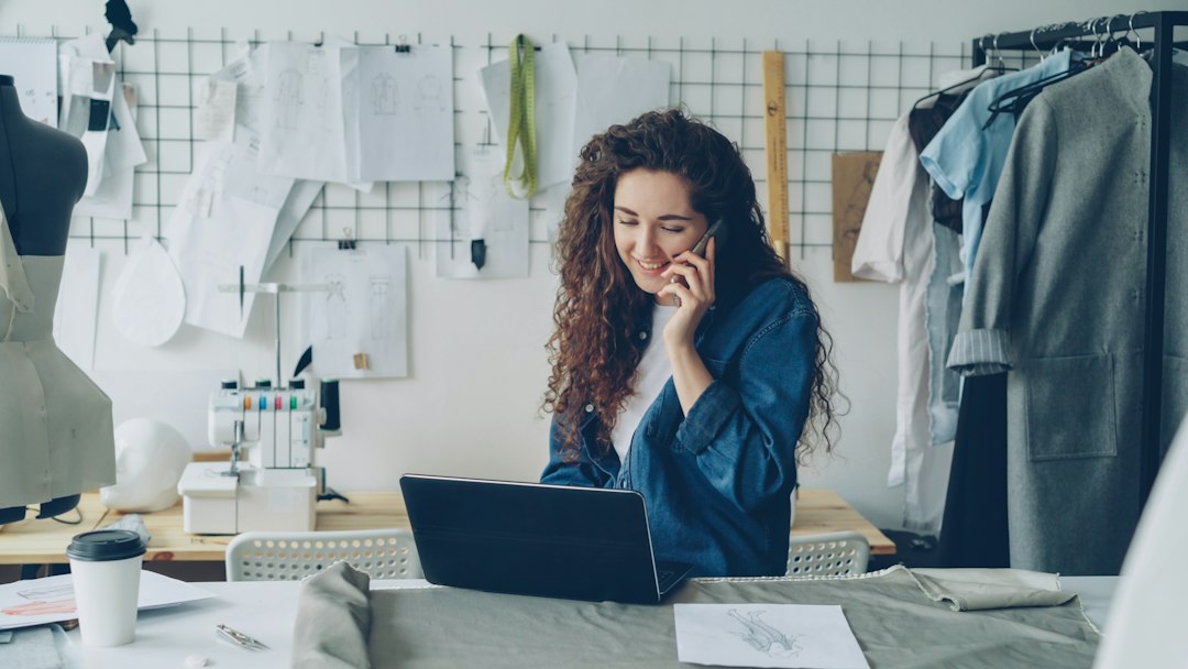 Small business owner using a laptop while planning business automation
